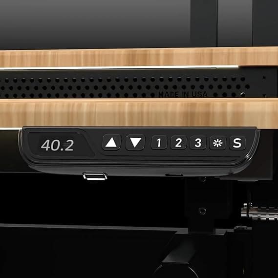 Extra-wide L-shaped standing desk with electric adjustment in corner office