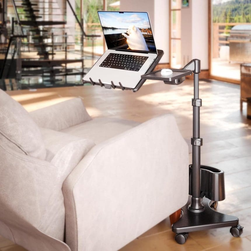 Adjustable LEVO G2 Deluxe Laptop Stand on wheels next to a sofa