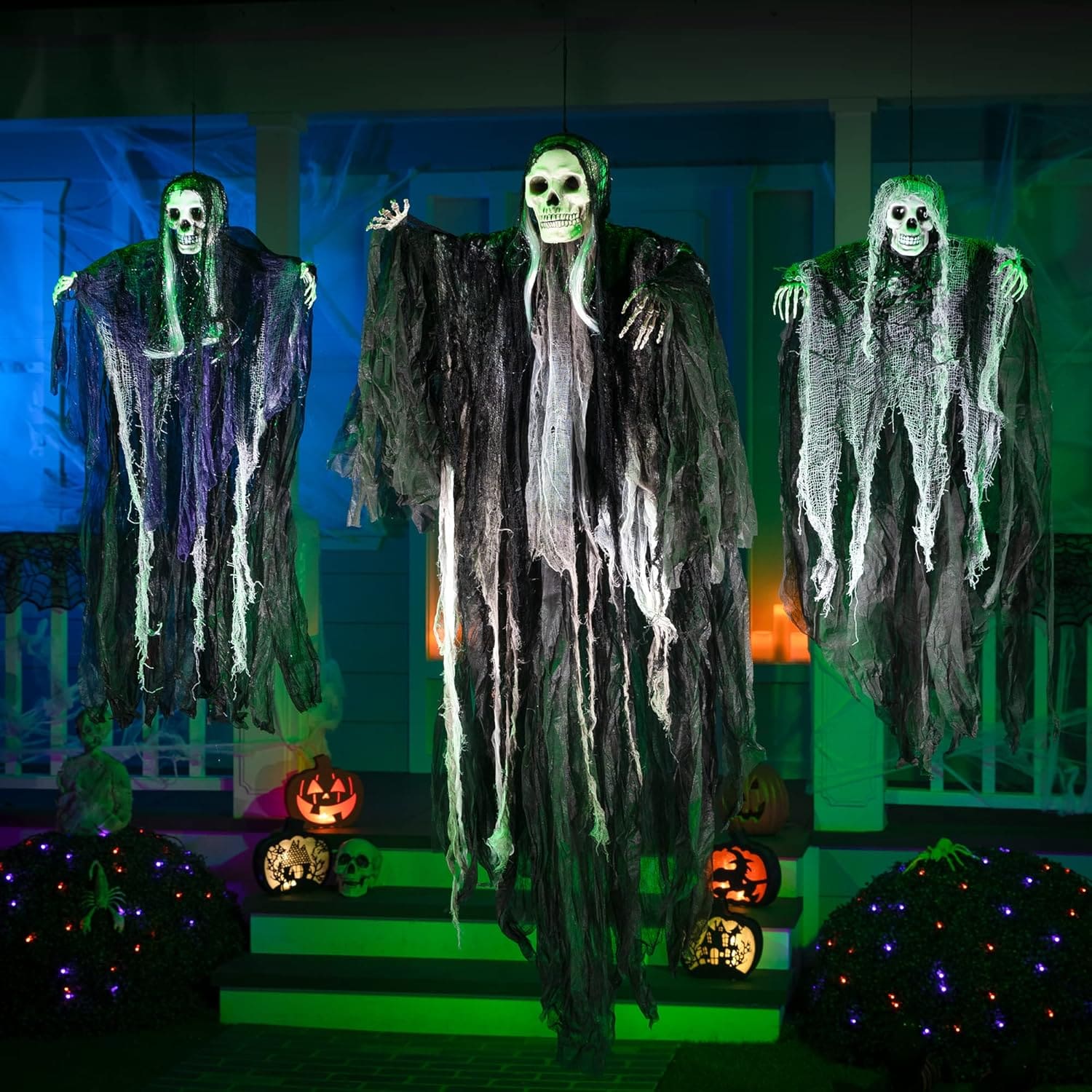 Hanging outdoor Halloween decorations with ghosts