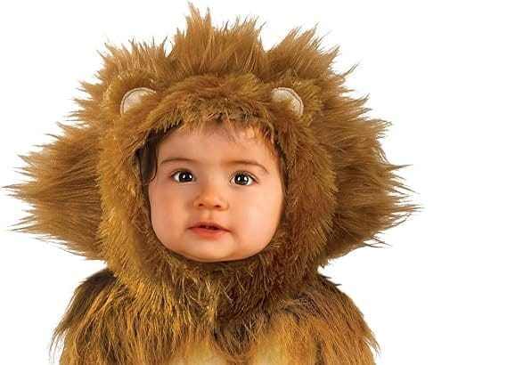 Baby smiling in Rubie’s lion cub baby Halloween costume