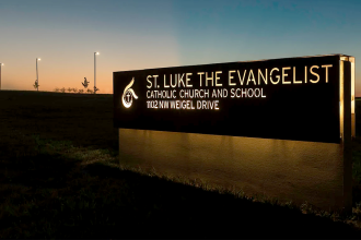 st luke school sign car hits students